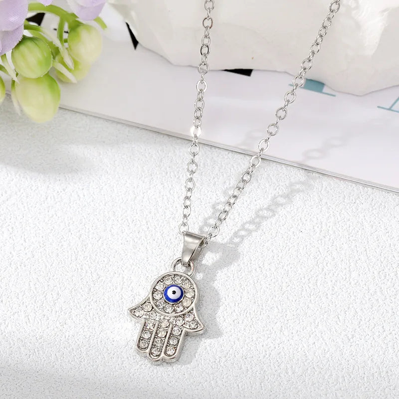 Silver Zircon Evil Eye Hamsa Pendant Necklace For Sale | Green Witch Creations